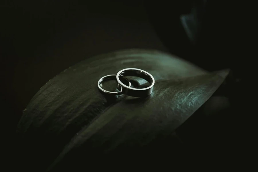 A pair of rings on a black surface