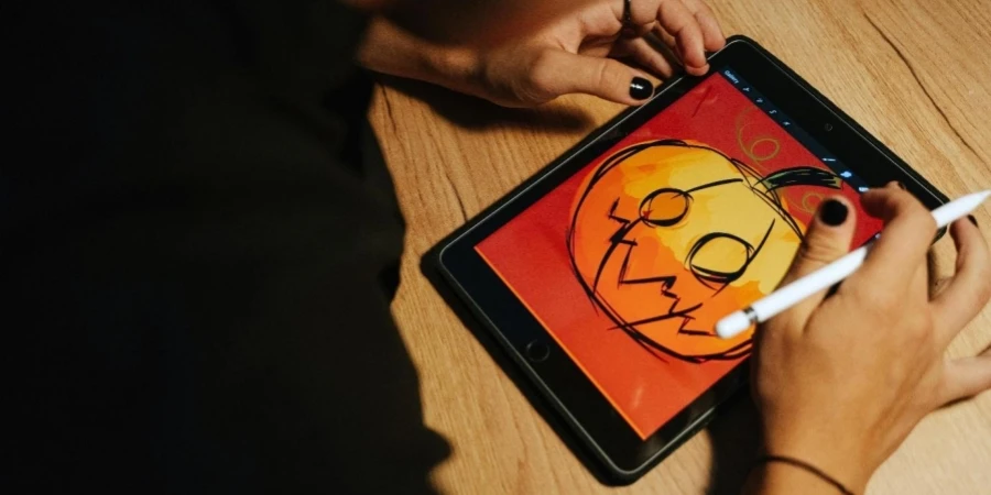 A person drawing on a tablet