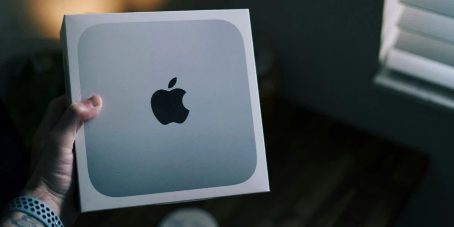 A person holding a box with a logo