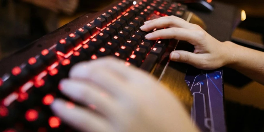 A person typing on a keyboard