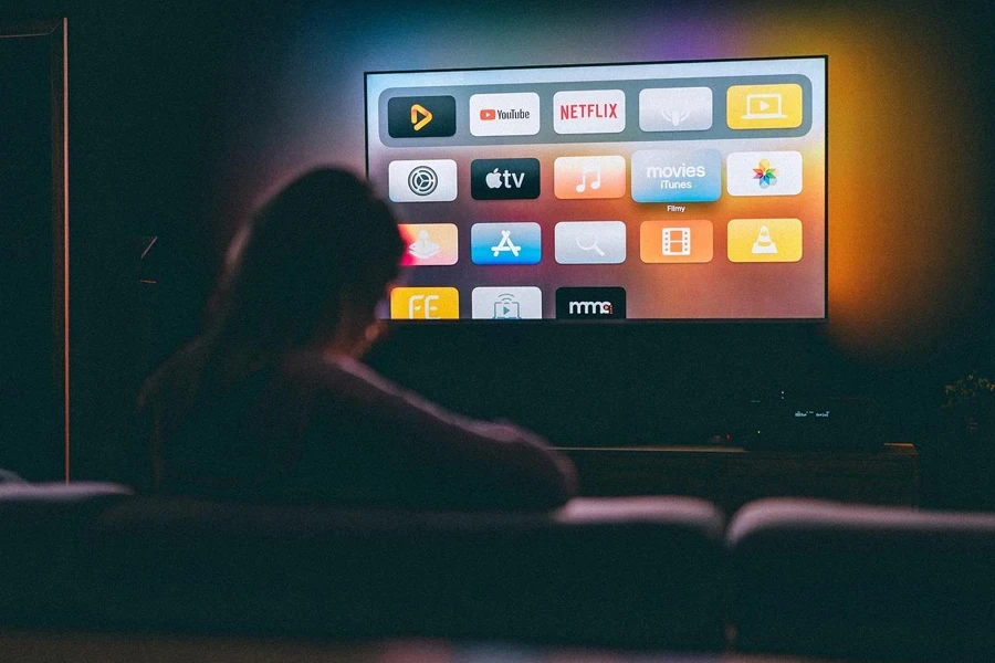 A person watching a television