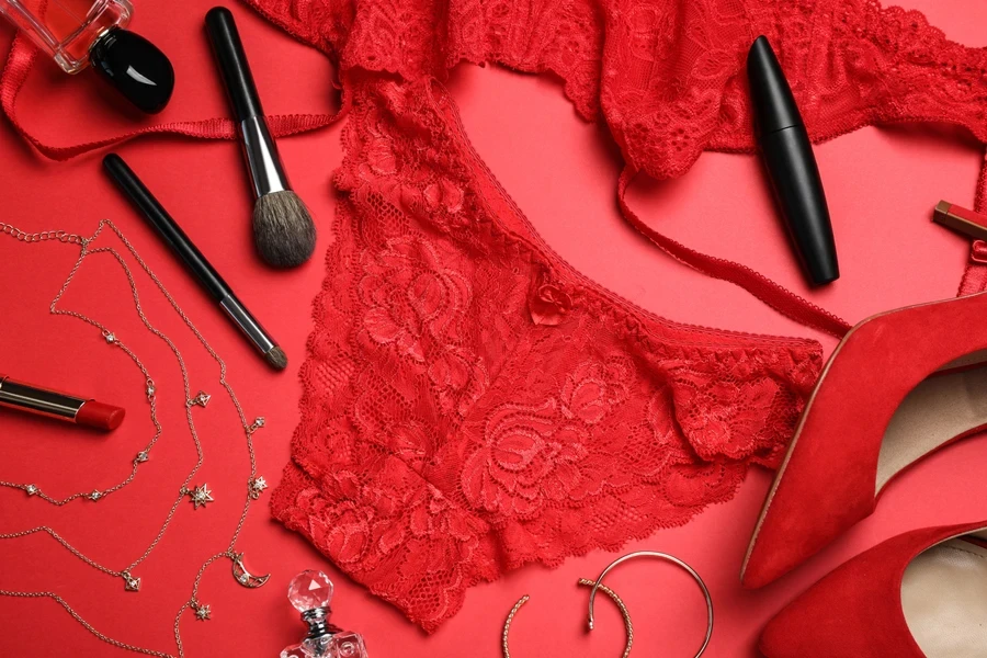 A red lace bikini among makeup accessories