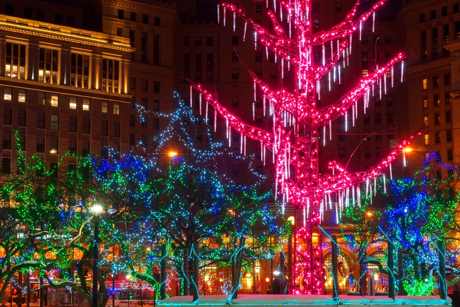 A selection of string and icicle lights on outdoor trees