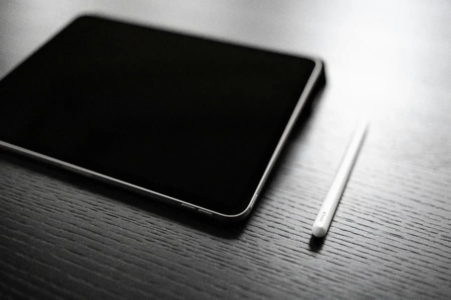 A tablet and stylus on a table