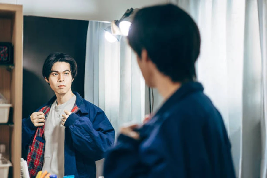 Asian Man with a Fashion Retro Jacket and Hairstyle Dressed up at Home