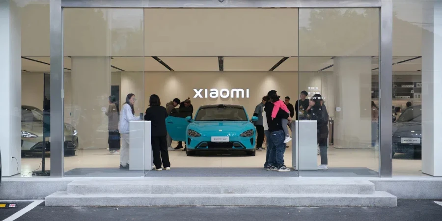 Chinese customers at Xiaomi ev store test SU7 electric car