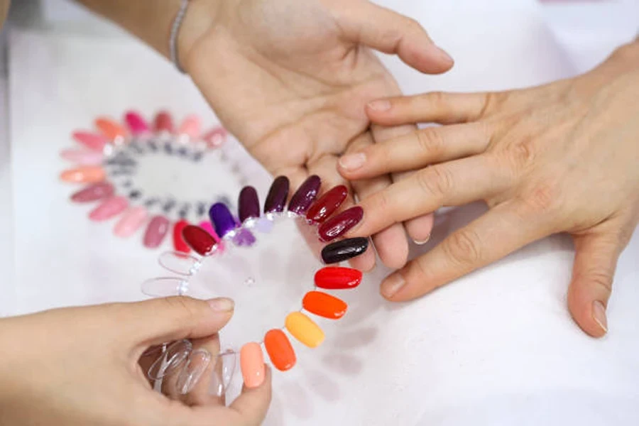 Circle of acrylic nails in different colors at salon