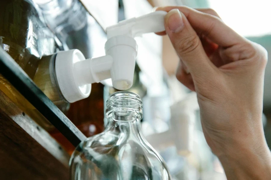 Close-up of Person Using Plastic Bottle with Pump