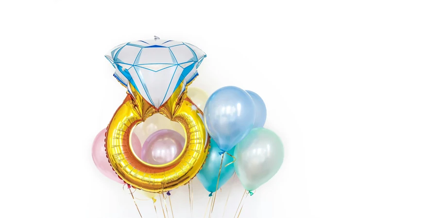 Colorful glossy different shaped balloons in studio