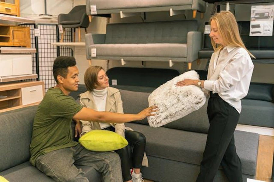 Couple browsing a furniture shop to select a customized pillow