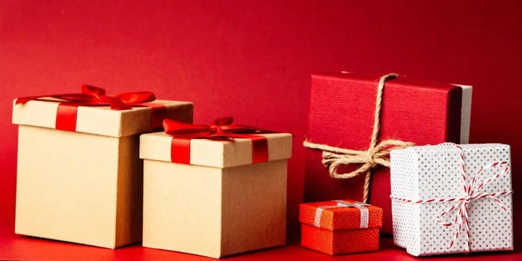 Different Christmas gifts on a red background