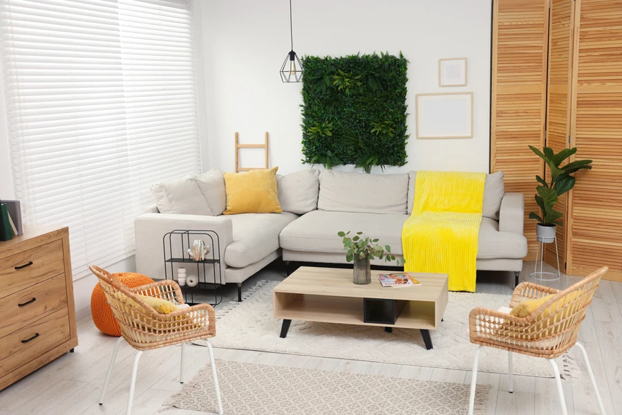 Eco-friendly living room with green plants and gray sofa