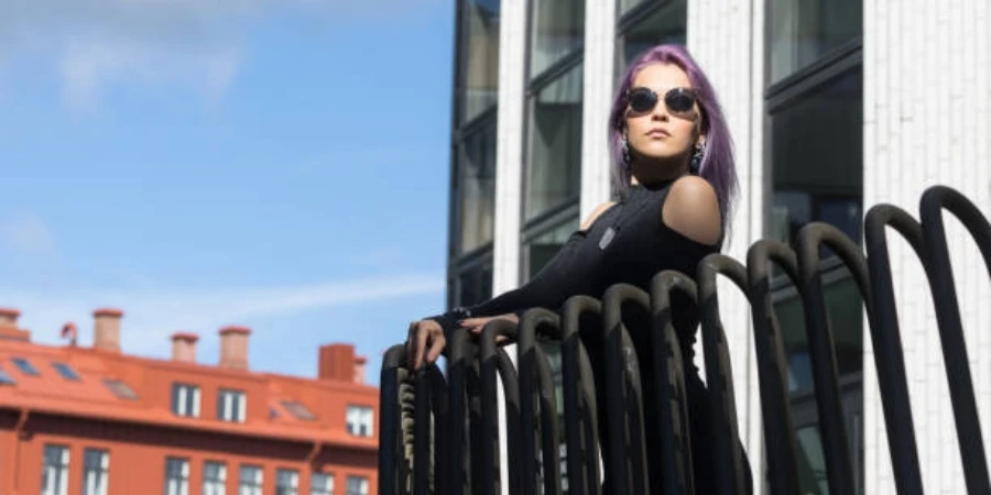 Female Model Standing on the Balcony of the Building