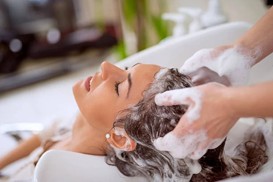 Hairdresser Washing Hair