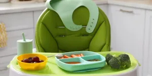 High Chair with Food in Baby Tableware