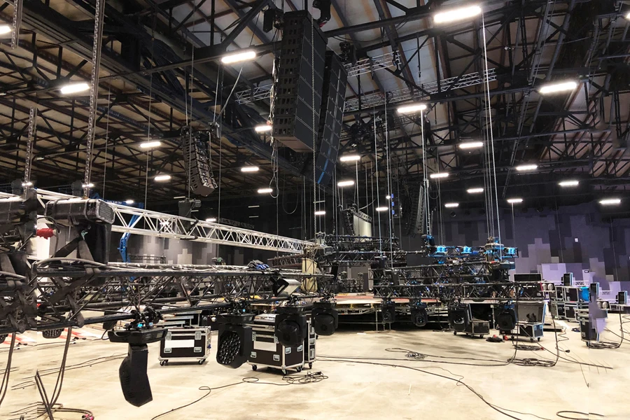 Installation of professional sound, light, video and stage equipment for a concert. Lifting of line array speakers