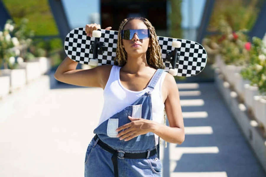 Lack Woman with Skateboard in City