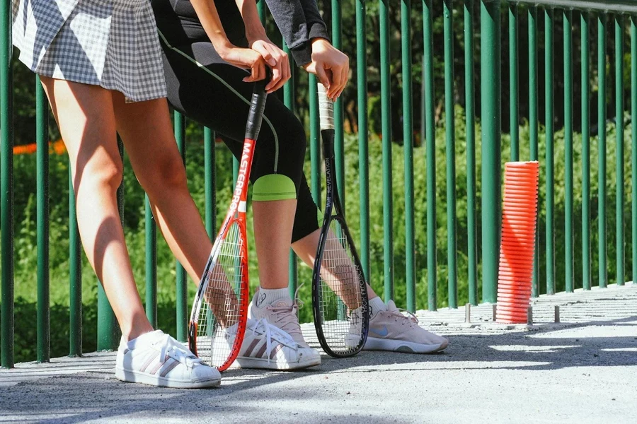 Lady standing in a patterned tennis skirt