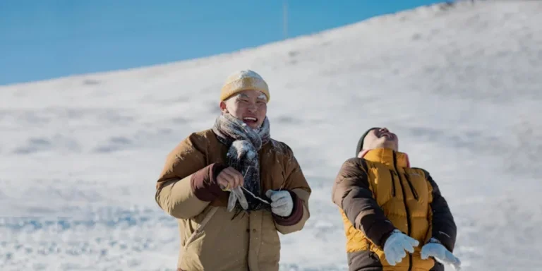 Laughing men wearing winter gloves