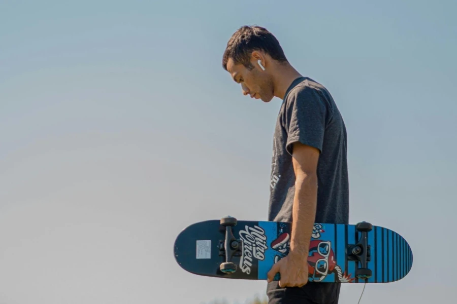 Man Holding A Skateboard