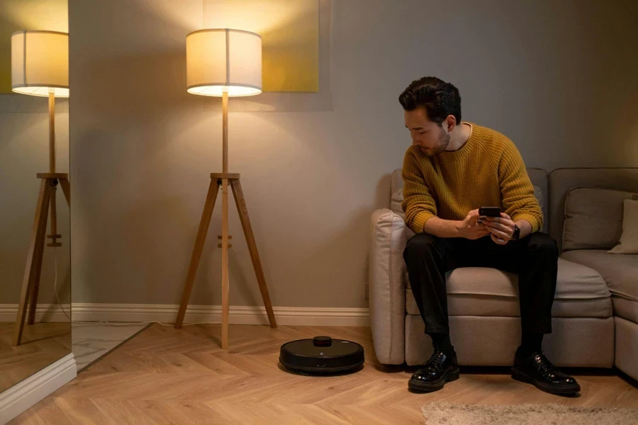 Man in Brown Sweater Sitting on White Sofa Chair