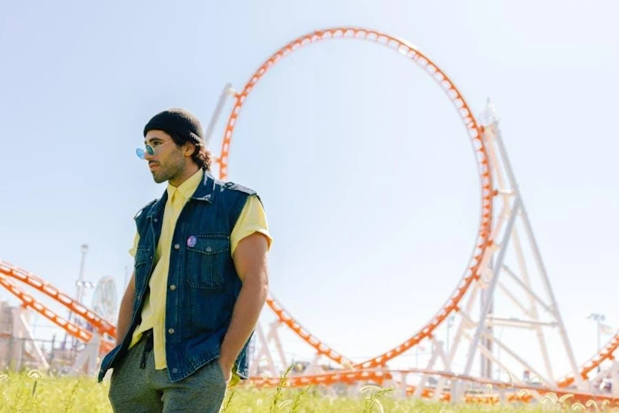 Man rocking a denim vest at a park