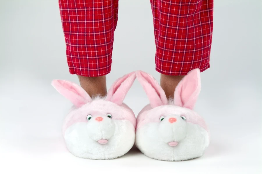 Man wearing quirky bunny slippers