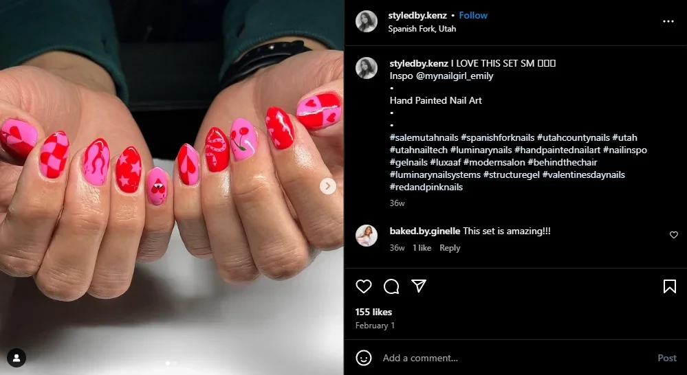 Model showing off red and pink nail art