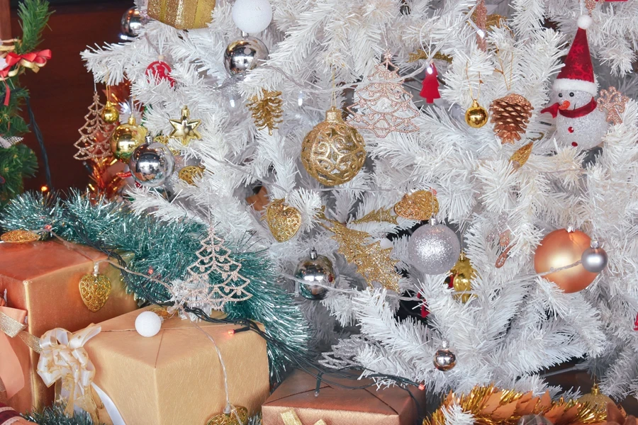 Ornaments in soft colors on a white Christmas tree