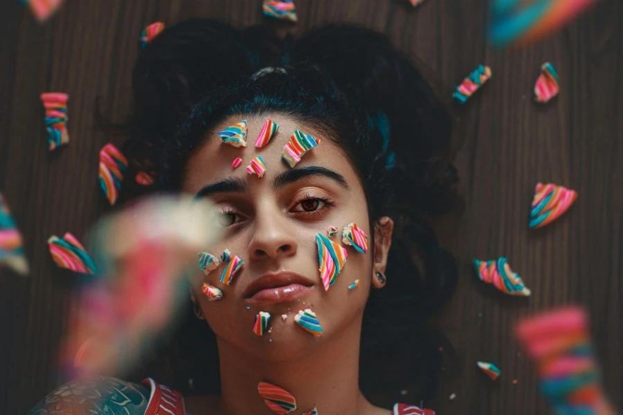 Photo Of Woman With Candies On Her Face