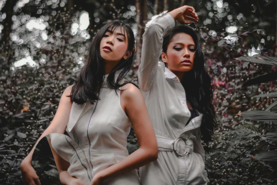 Photo of Two Women Standing Near Plants