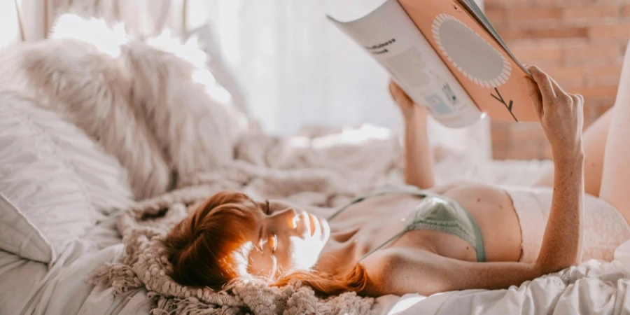 Photo of woman lying on bed