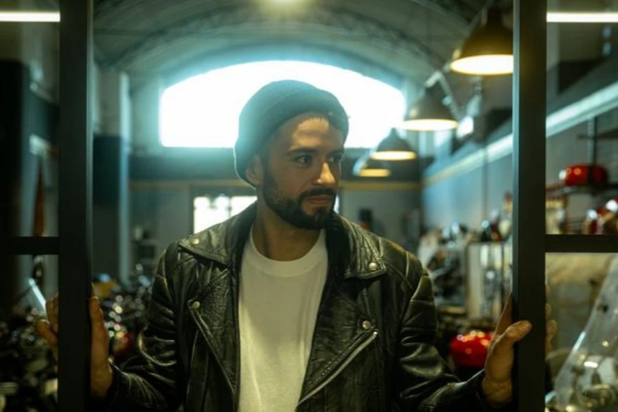 Portrait of a man in a garage bike shop