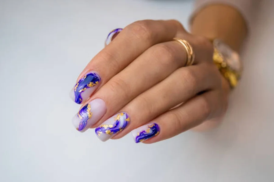 Purple and gold foil long nails with lavender base