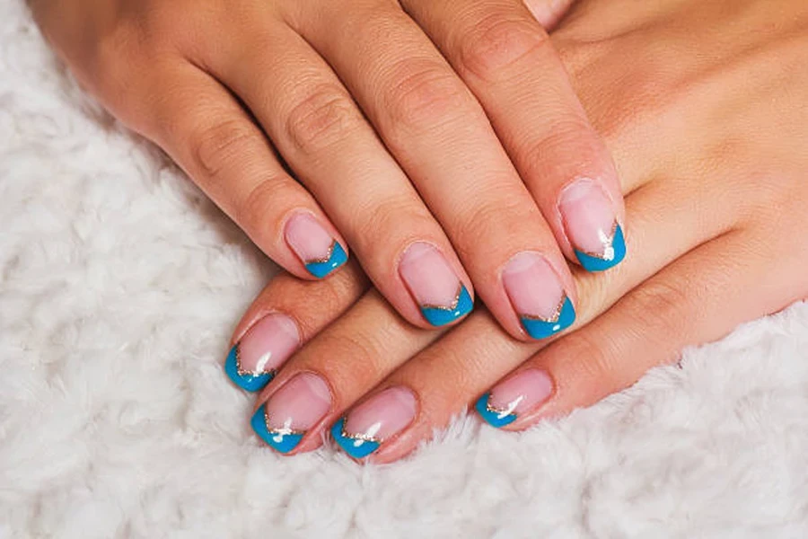 Short nails with icy blue French tip design