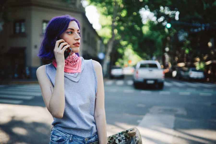 Skater Girl Talking on the Phone in the Street in Buenos Aires