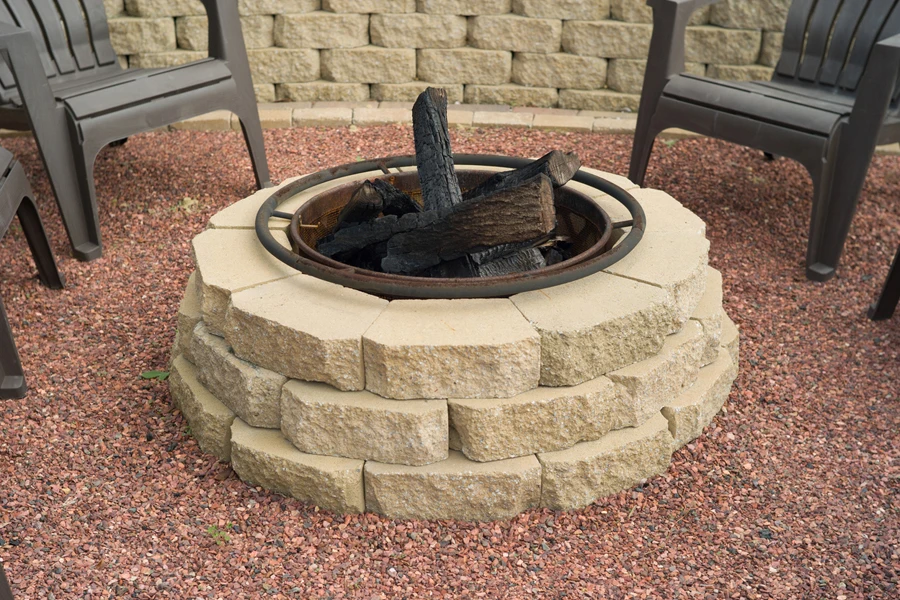 Smokeless fire pit encircled with stone