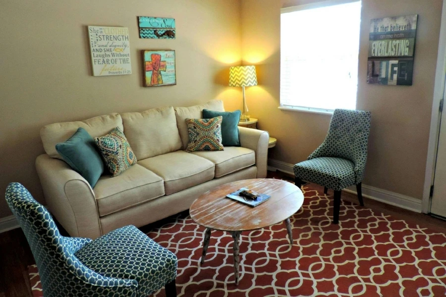 Sofa and two chairs with a center table in a living room