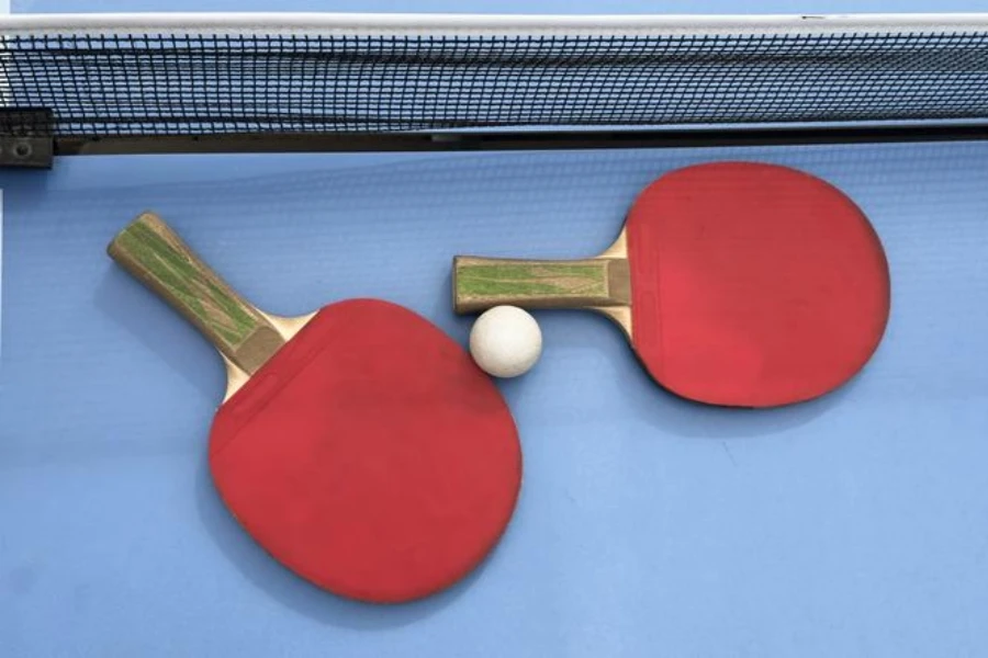 Table tennis racket and ball on a tennis table