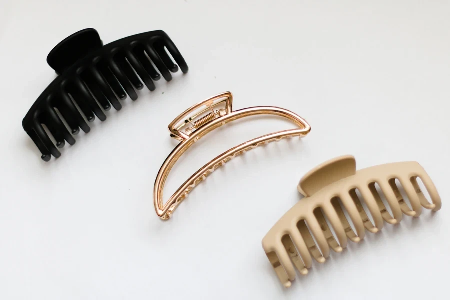 Three oversized claw clips on a white background