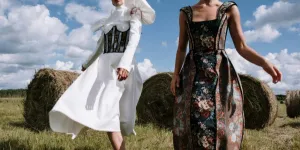 Two Women in Stylish Outfits Standing on Farm