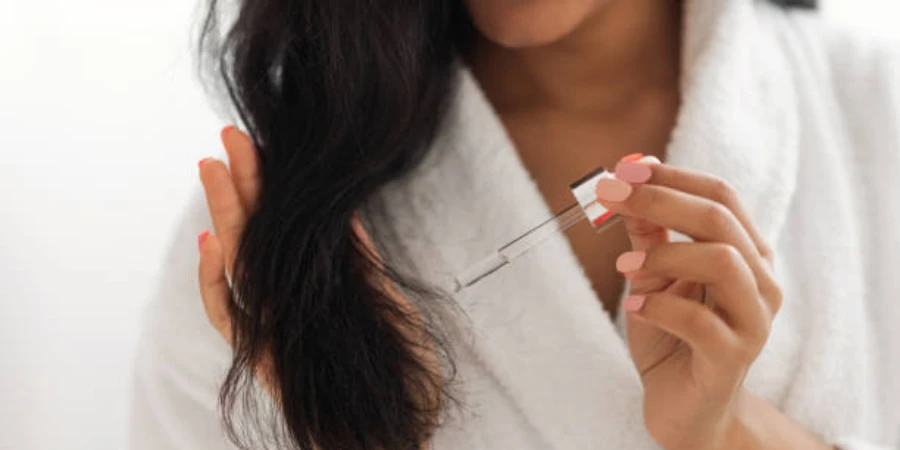 Woman Applying Serum on Hair