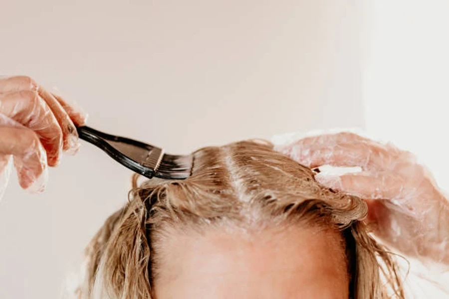 Woman Dyeing Hair at Home