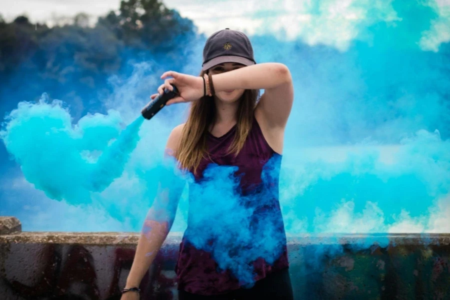 Woman Holding Blue Smoke Flare