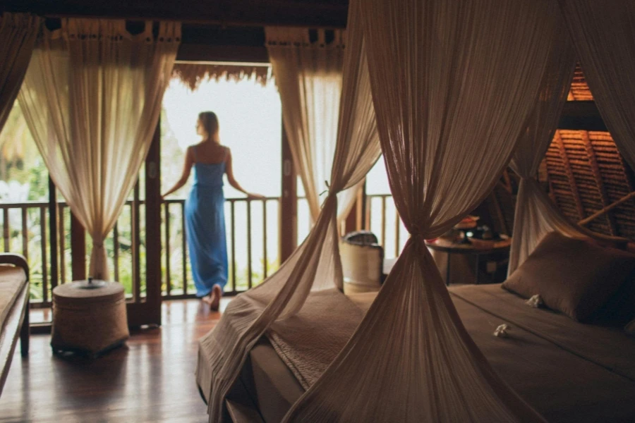 Woman Leaning on Handrail in Room