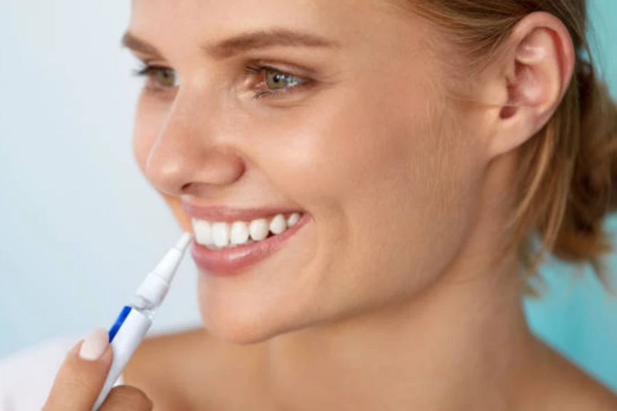 Woman Using Whitening Pen