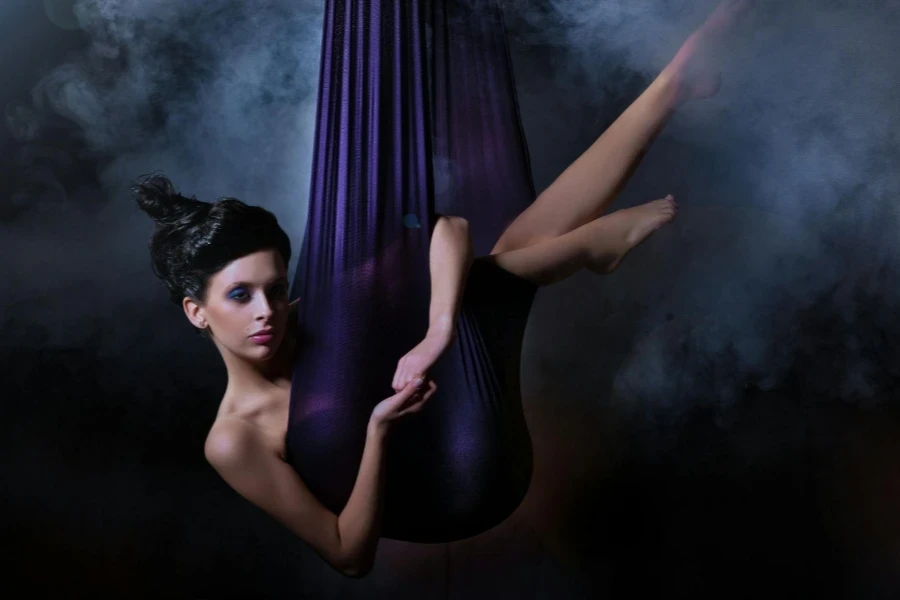 Woman hanging on purple textile