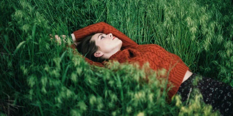 Woman lying on grass