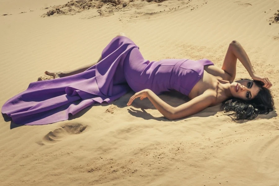 Woman lying on sand