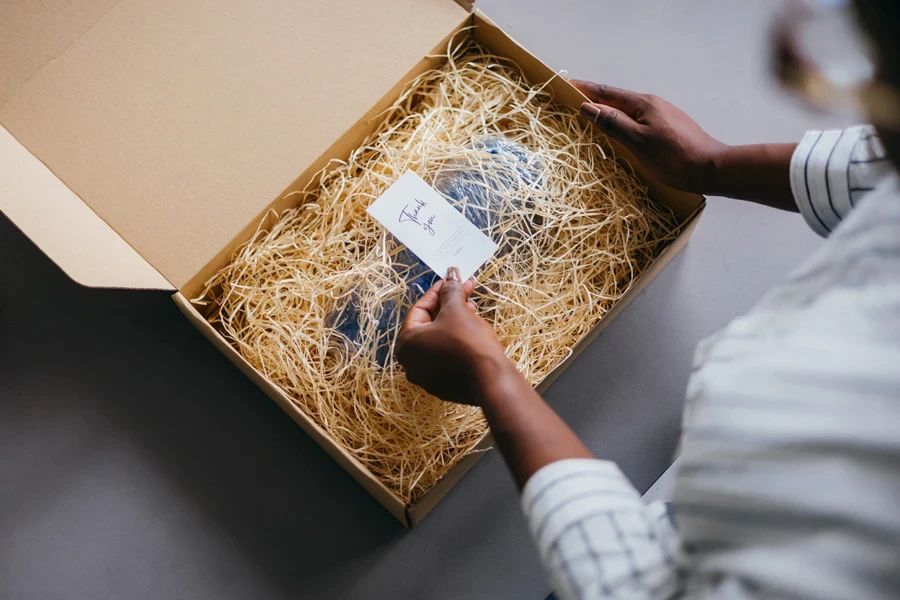 Woman opening a box with a personalized gift